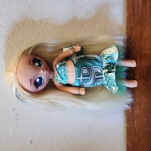 NA NA Surprize Blonde Doll with Blue Eyes Money Green Dress